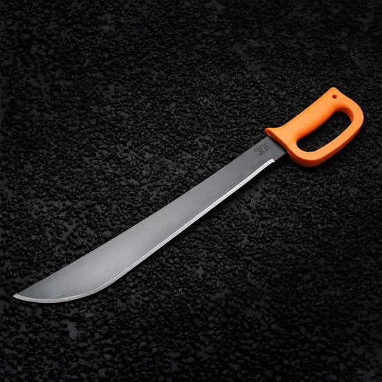 Okapi machete with D-ring hand guard and Okapi Orange grip shown in forest setting