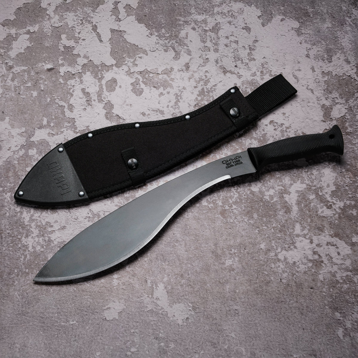 Okapi Kukri Machete with  black handle with black Sheath on grey background
