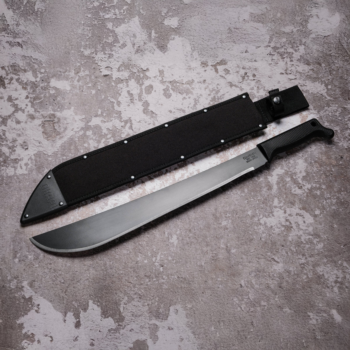 Okapi Latin Machete with black Sheath cover on grey background