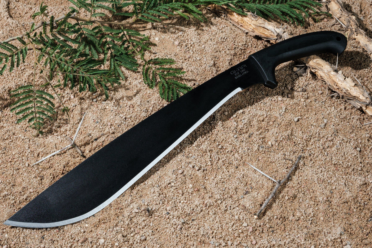 Okapi Jungle Machete with black handle with black Sheath on sandy background