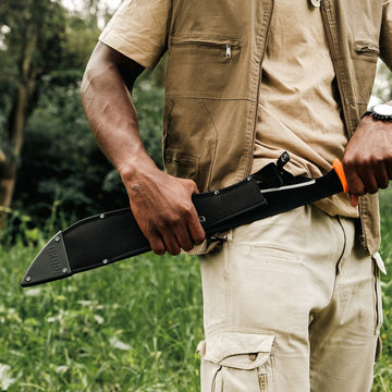 Outdoor-style Okapi jungle machete in sheath with Okapi orange handle