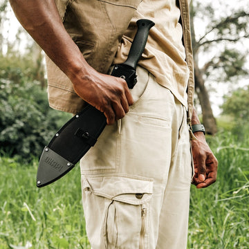 Okapi Kukri Machete Sheath in black held in hand grip