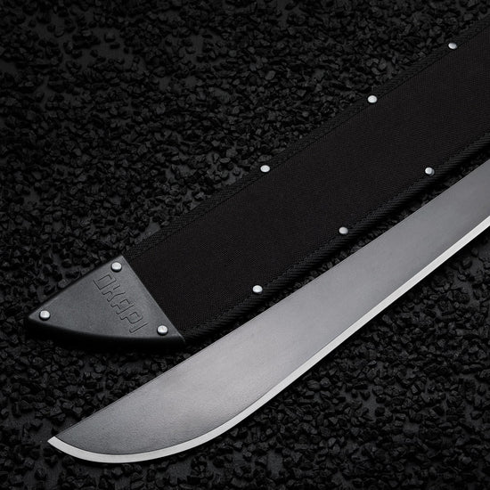 Okapi Latin-style machete with black handle and sheath displayed outdoors