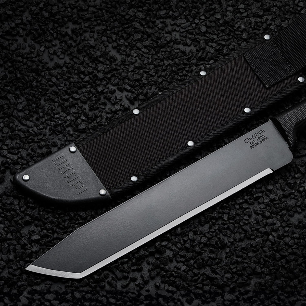 Okapi O-Tanto Sheath in black on black stone background